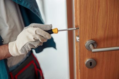 Handyman Working on Door